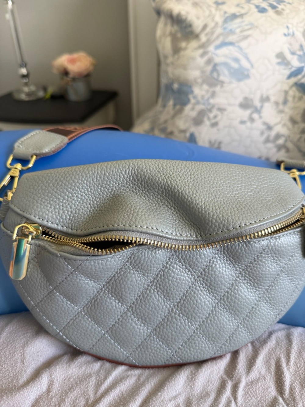 Eslcorri small crossbody leather sling bag in light blue.